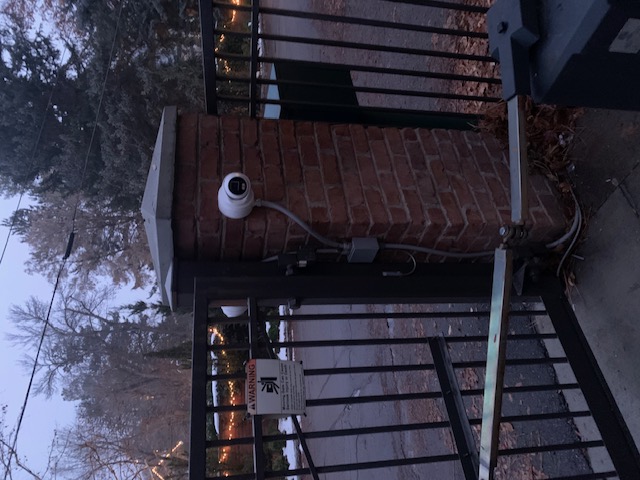 Automated gate camera operator showing integrated access and surveillance