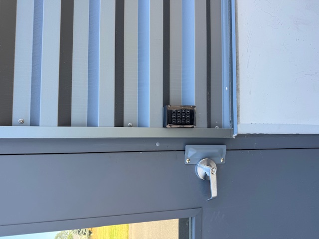 Exterior keypad access control at a building entrance