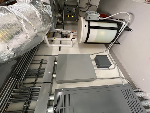 Mechanical controls room with installed panels and building systems